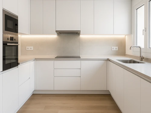 Reforma de cocina moderna en Caldes de Montbui Cocina reformada en Caldes de Montbui con muebles blancos, encimera de cuarzo y electrodomésticos empotrados